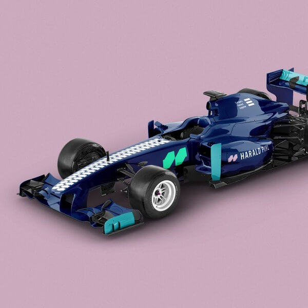 Formula One race car on a solid pink background.
