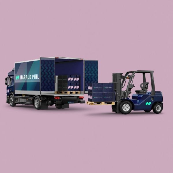 Harald Pihl delivery truck being loaded by a forklift against a pink background.